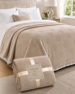 Premium Snowflake Comfort cut‑flower flannel blanket, gift‑packaged throw displayed on bedroom bed